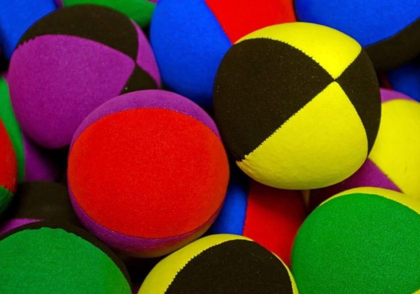 A pile of colorful balls sitting next to each other.